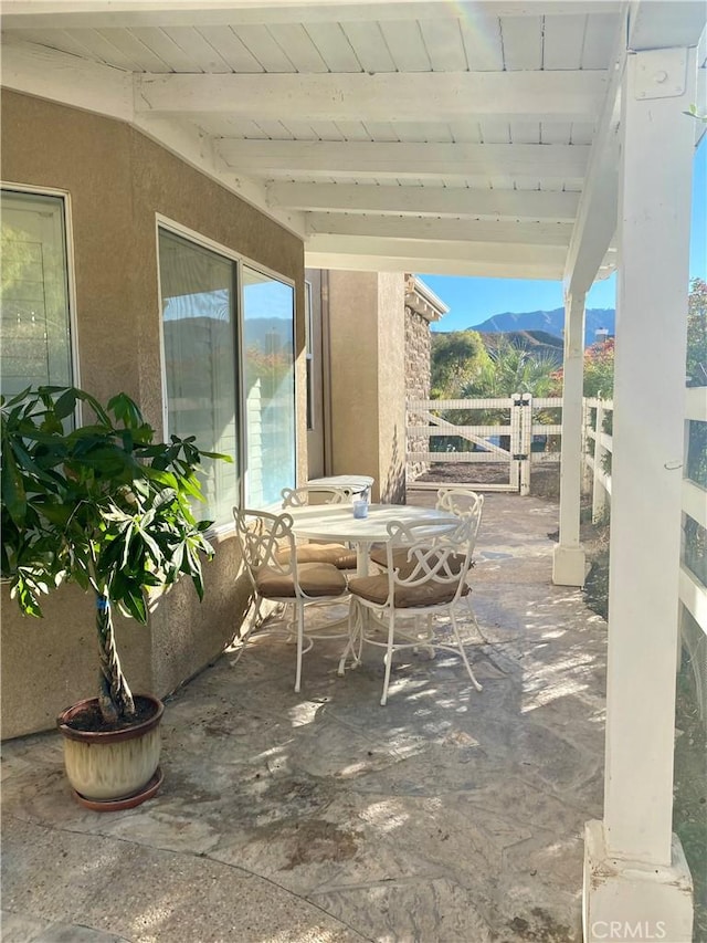 view of patio / terrace featuring a mountain view