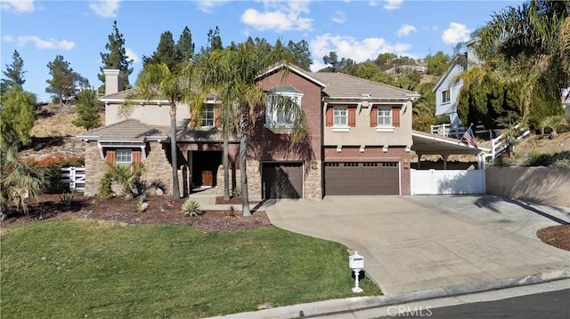 view of front of property with a front yard and a garage