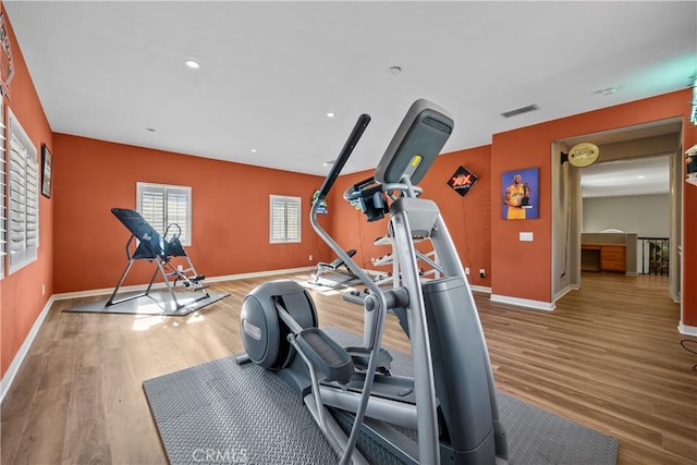 workout room featuring light hardwood / wood-style floors