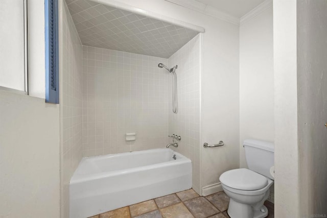 bathroom with crown molding, tiled shower / bath, and toilet