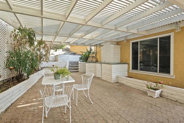 view of patio featuring a pergola