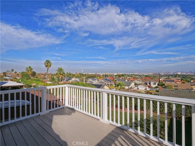 wooden deck featuring a residential view