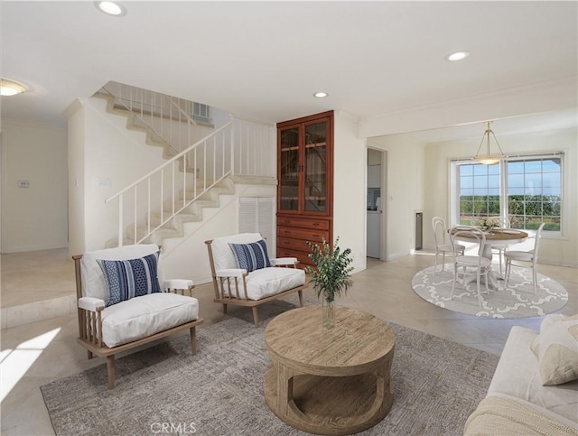 tiled living room featuring ornamental molding