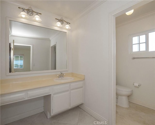 bathroom with a healthy amount of sunlight, vanity, tile patterned floors, and ornamental molding