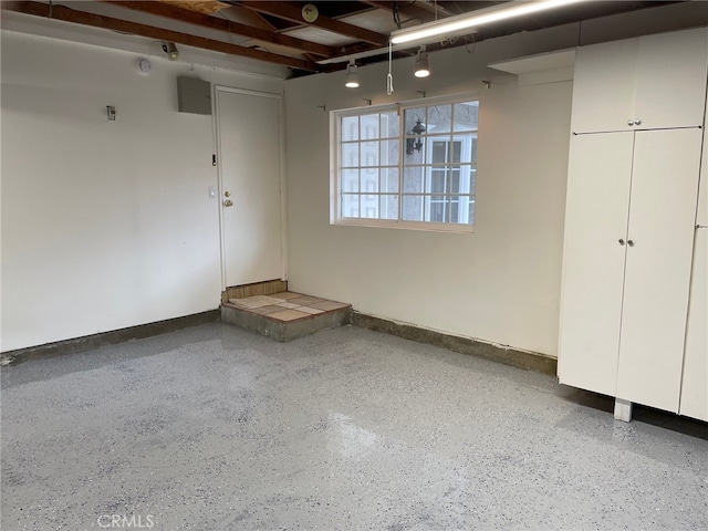 garage featuring baseboards