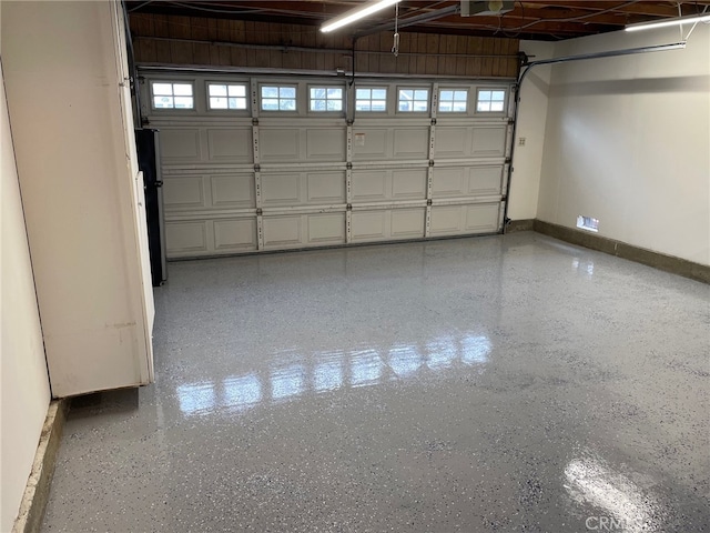 28708 Mount Sawtooth Dr, Rancho Palos Verdes, CA 90275 - garage with baseboards, freestanding refrigerator, and a garage door opener