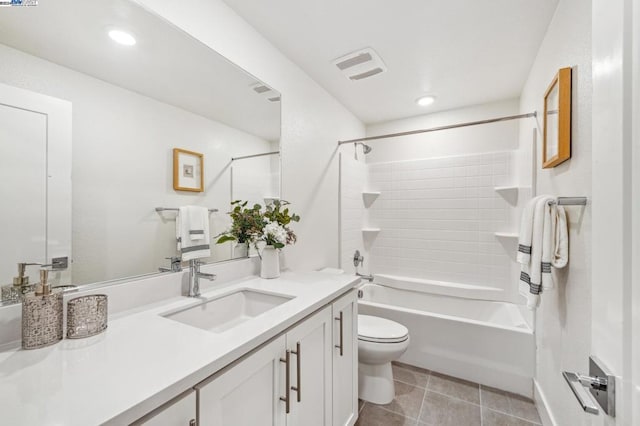 full bathroom with vanity, toilet, and tiled shower / bath combo