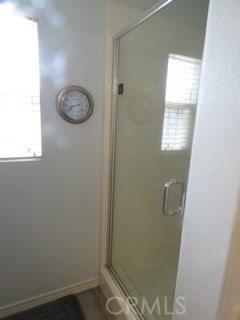 bathroom featuring an enclosed shower