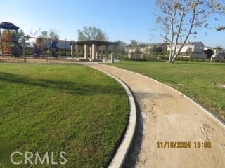 view of property's community with a lawn