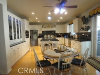 dining area featuring ceiling fan and a healthy amount of sunlight