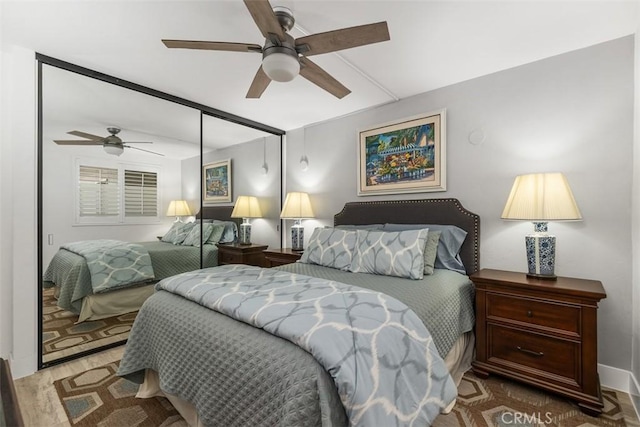 bedroom with hardwood / wood-style flooring and ceiling fan