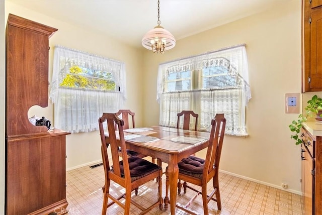 dining space with a notable chandelier