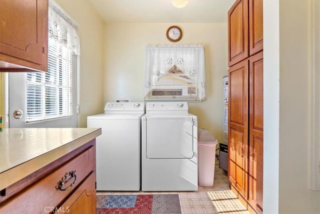 laundry room with cabinets and separate washer and dryer