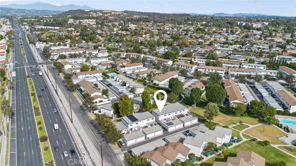 birds eye view of property with a mountain view