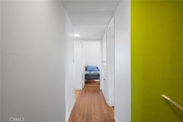 corridor featuring hardwood / wood-style floors