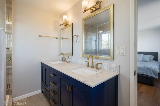 bathroom with hardwood / wood-style floors and vanity