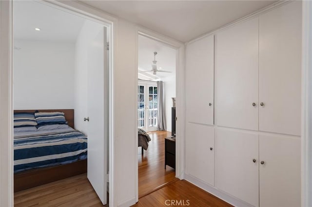 bedroom with hardwood / wood-style floors and a closet