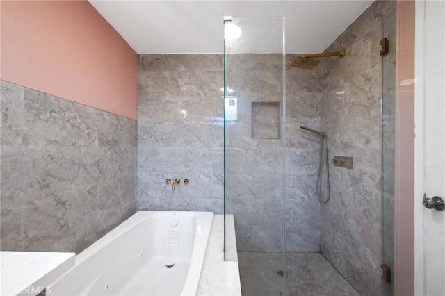 bathroom with shower with separate bathtub