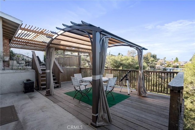 wooden deck featuring a pergola