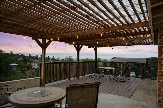 deck at dusk with a pergola