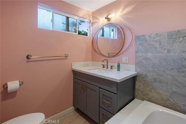 bathroom with vanity and toilet