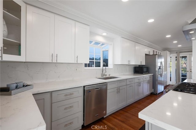 kitchen with white cabinets, a wealth of natural light, sink, and appliances with stainless steel finishes