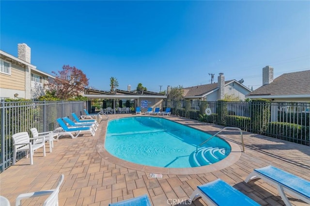 view of swimming pool with a patio area