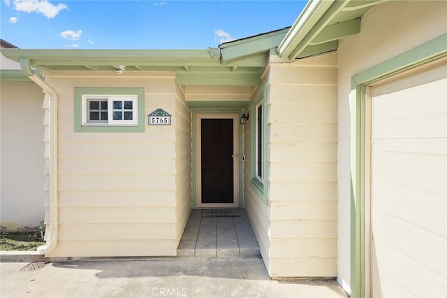 property entrance with a garage