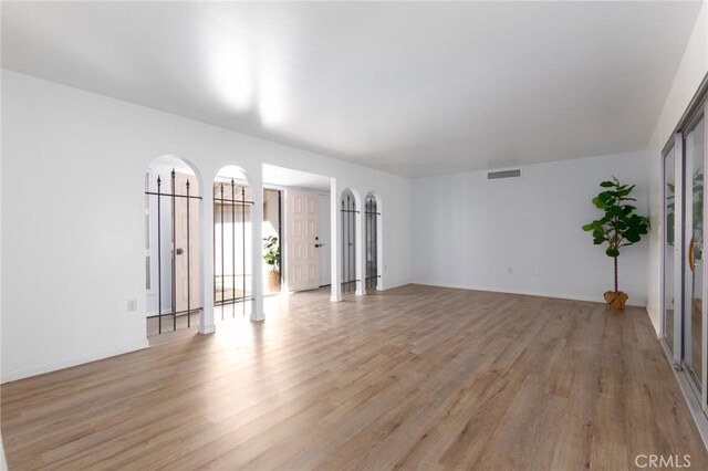 spare room featuring light hardwood / wood-style floors