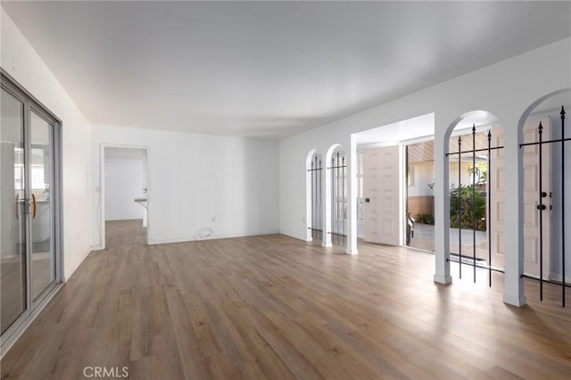 spare room with wood-type flooring