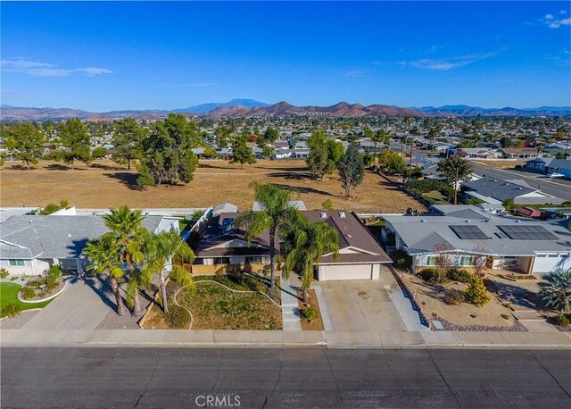 birds eye view of property featuring a mountain view