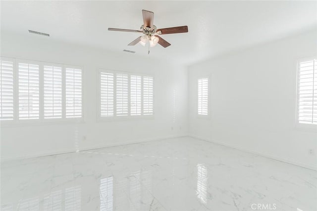 empty room featuring ceiling fan