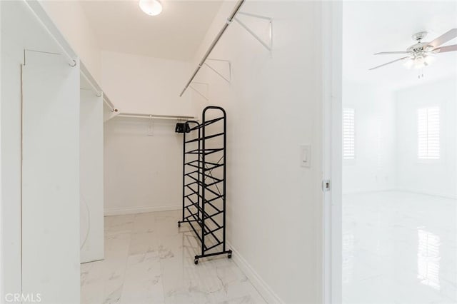 spacious closet featuring ceiling fan