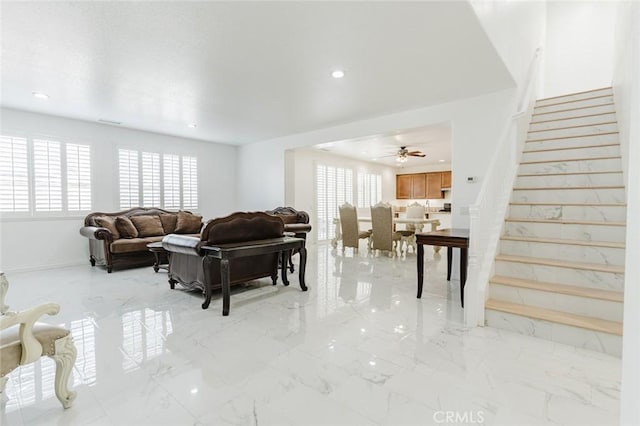 living room featuring ceiling fan