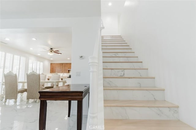 stairway with ceiling fan