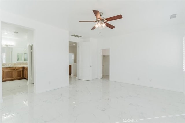 unfurnished room with ceiling fan