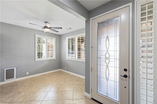 entrance foyer featuring ceiling fan and light tile patterned flooring