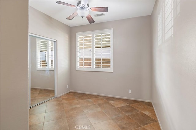 unfurnished bedroom featuring a closet and ceiling fan