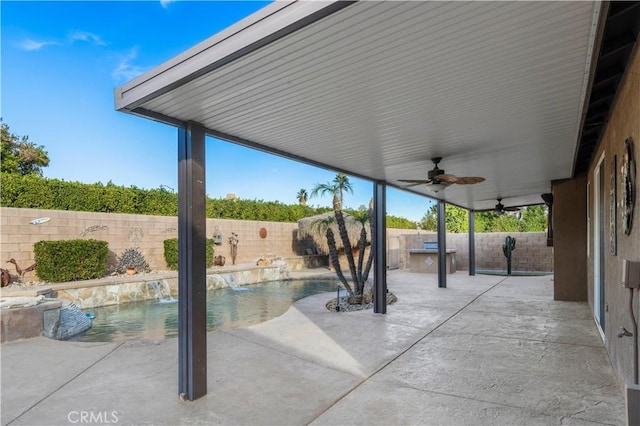 view of patio / terrace featuring pool water feature and ceiling fan