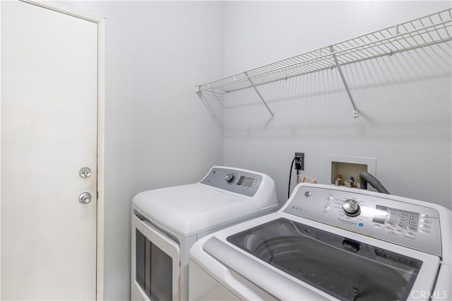 laundry room with washer and dryer