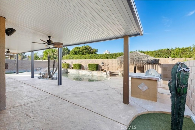 view of patio with ceiling fan and exterior kitchen