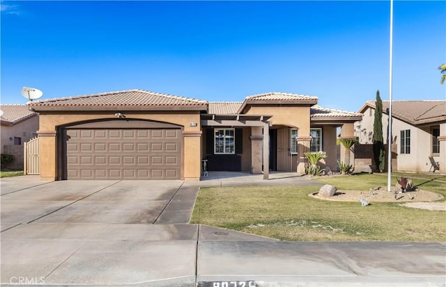 mediterranean / spanish-style house with a front lawn and a garage