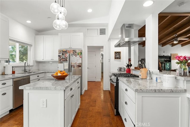 kitchen with pendant lighting, white cabinets, lofted ceiling with beams, sink, and appliances with stainless steel finishes