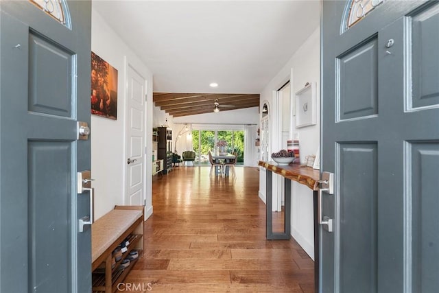 foyer entrance with hardwood / wood-style flooring and lofted ceiling