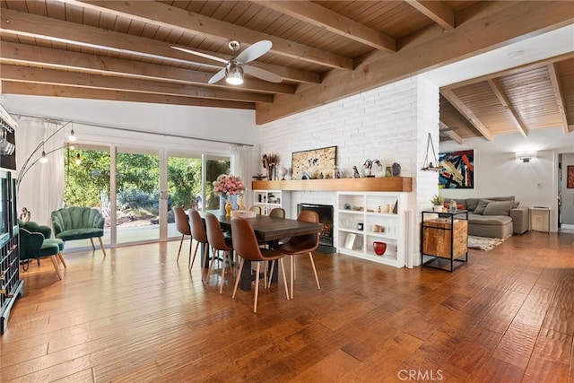 dining room with vaulted ceiling with beams, wood-type flooring, and wooden ceiling