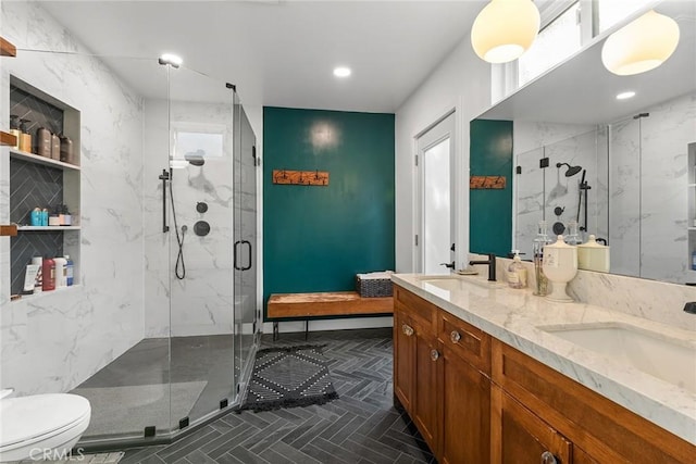 bathroom with vanity, toilet, and walk in shower