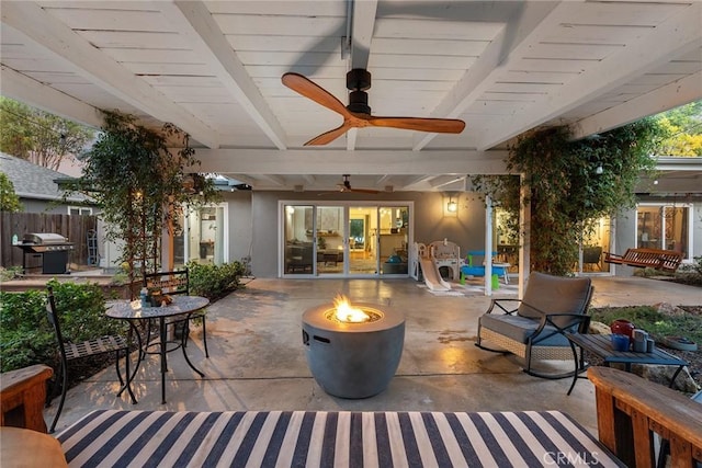 view of patio / terrace featuring a fire pit, ceiling fan, and grilling area