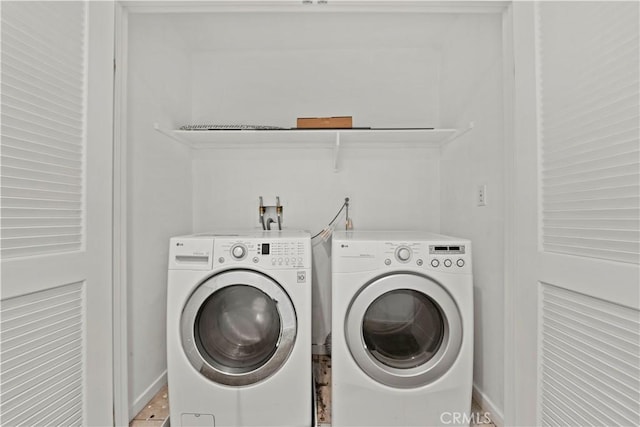 laundry room featuring separate washer and dryer