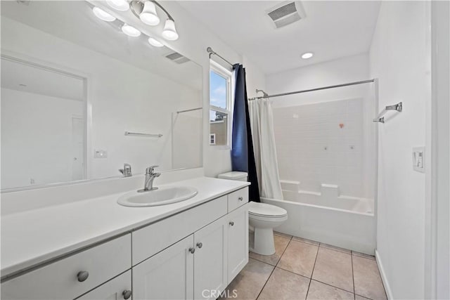 full bathroom featuring tile patterned flooring, vanity, shower / bath combo, and toilet