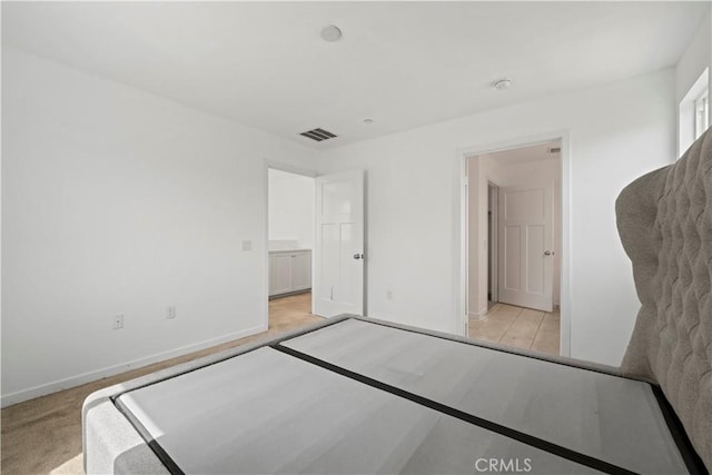 unfurnished bedroom with light carpet